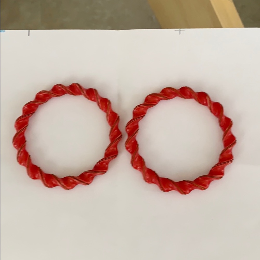 Two red plastic round bracelets. Retro era